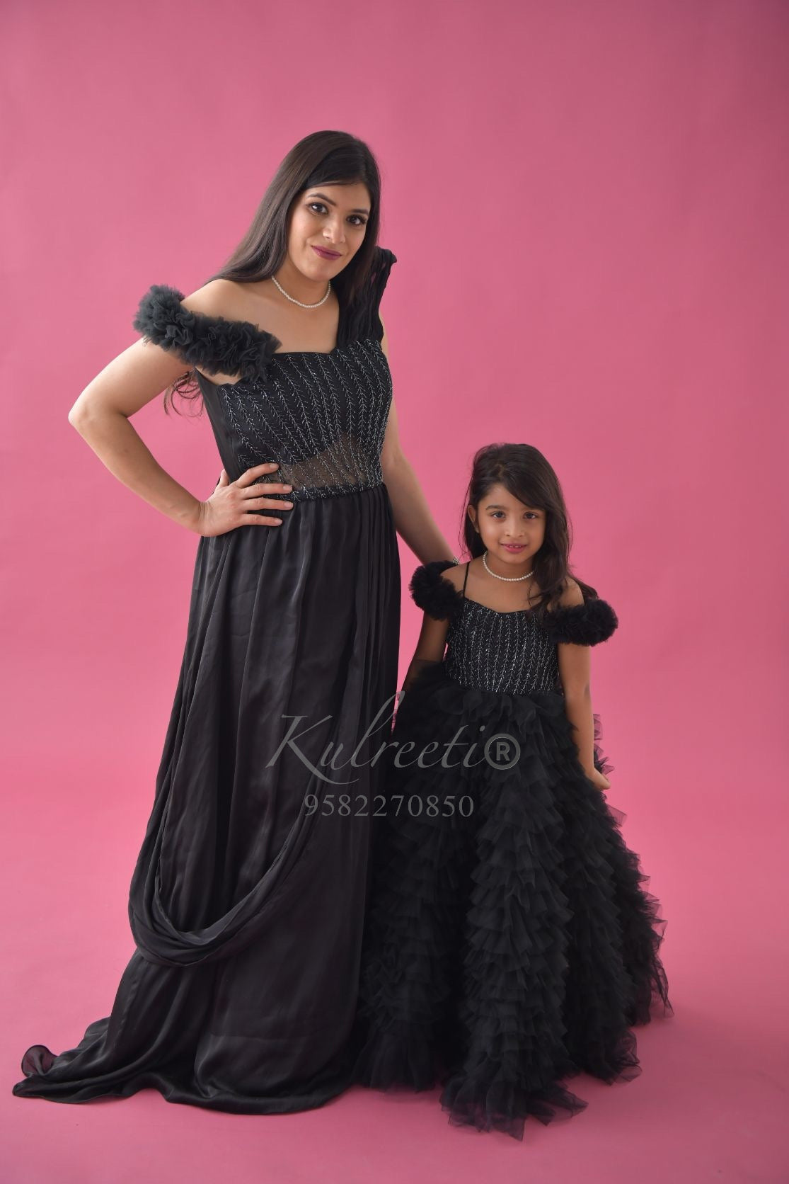 Mom and daughter shop matching black dress