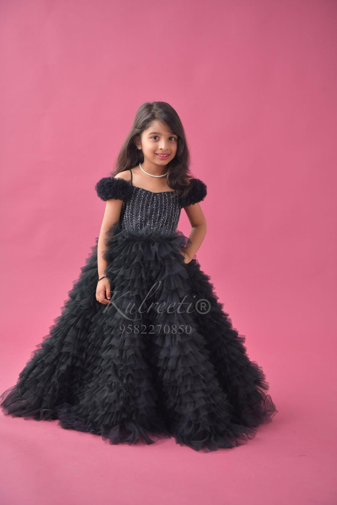 Black multilayer frill top gown and hand embroidery