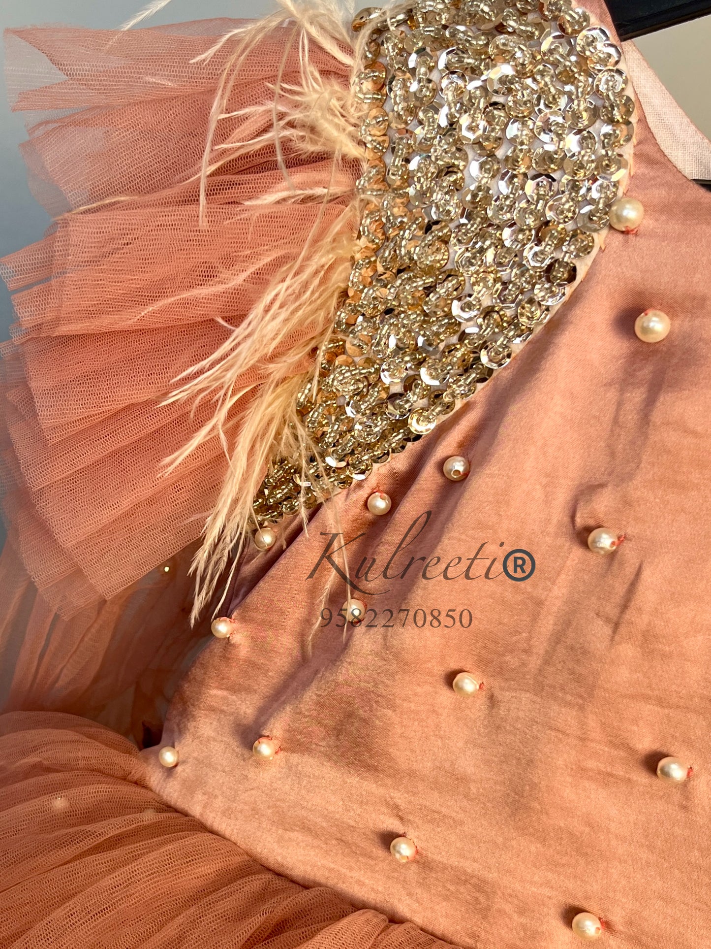 peach color pearl dress with unique embroidered  shoulders